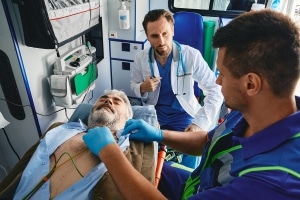 Cardiac emergency in an ambulance with EMS professionals
